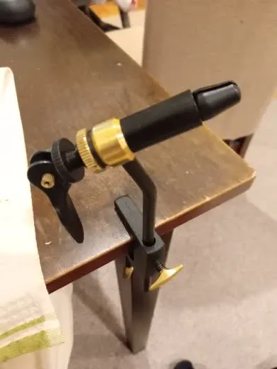 Verified buyer photo showing the Tailwater fly tying vise clamped and holding a hook